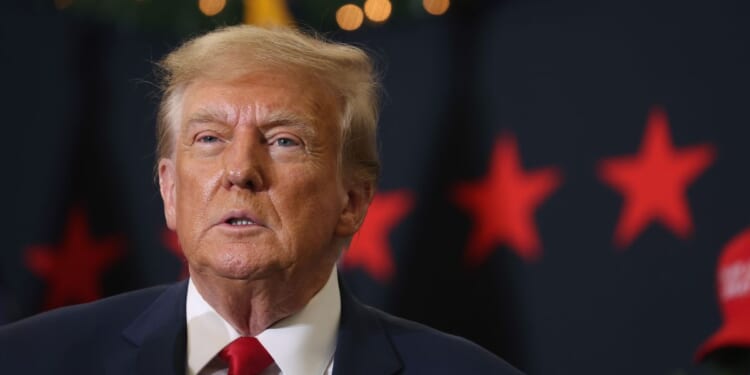 Former President Donald Trump looks on during a campaign event on Tuesday in Waterloo, Iowa.