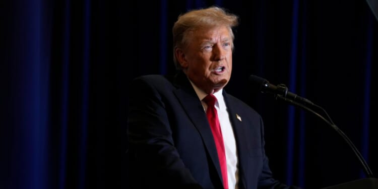 Donald Trump speaking during a commit to caucus rally in Iowa