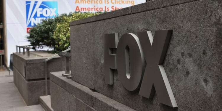 The Fox logo is displayed outside the News Corp Building in New York City.