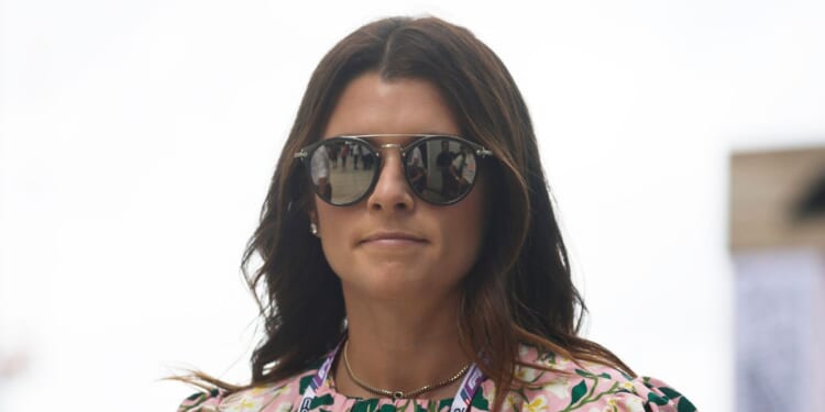 Danica Patrick walks in the Paddock prior to the F1 Grand Prix of Miami at the Miami International Autodrome on May 8, 2022 in Miami, Florida.