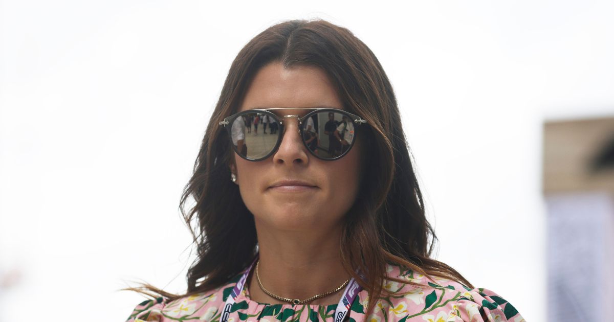 Danica Patrick walks in the Paddock prior to the F1 Grand Prix of Miami at the Miami International Autodrome on May 8, 2022 in Miami, Florida.