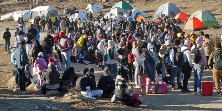 Migrants attempt to cross in to the U.S. from Mexico at the border in Jacumba Hot Springs, California, Dec. 17.