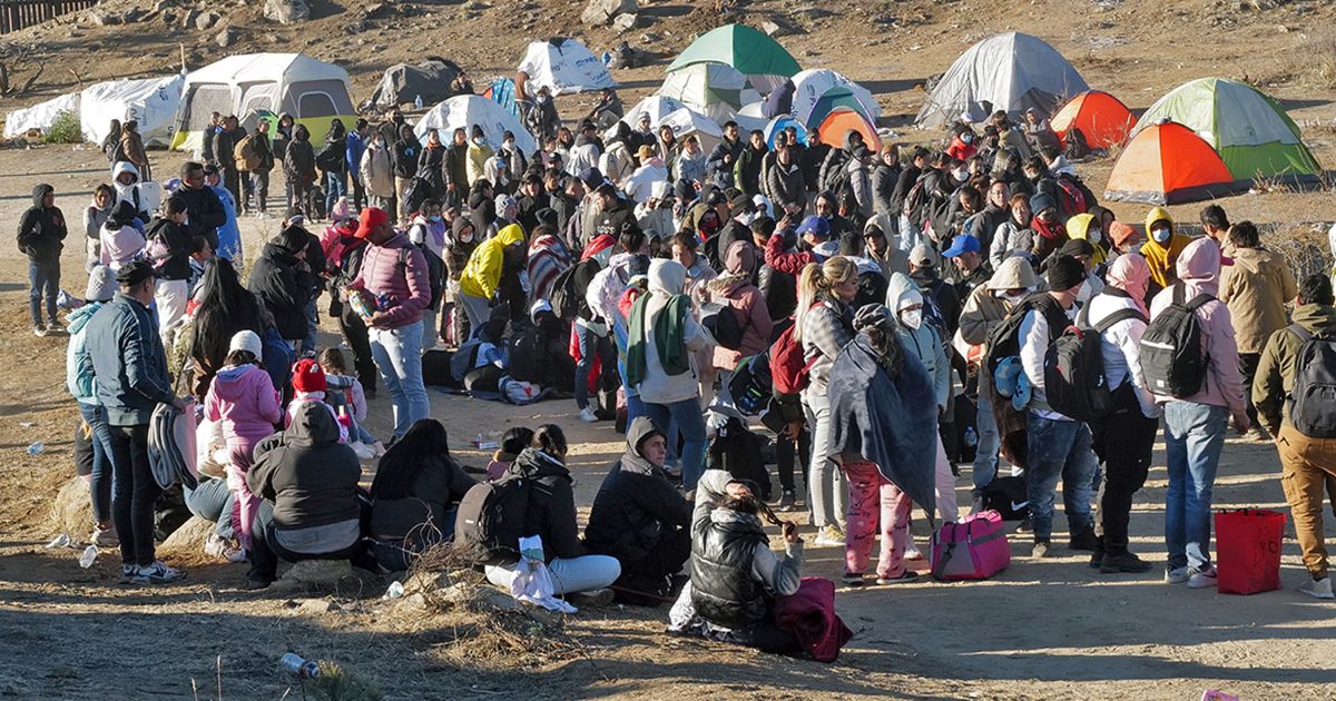 Migrants attempt to cross in to the U.S. from Mexico at the border in Jacumba Hot Springs, California, Dec. 17.