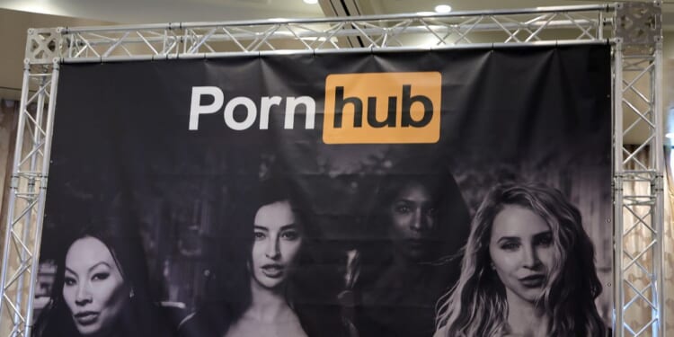 a sign at the Pornhub booth at a convention in Las Vegas