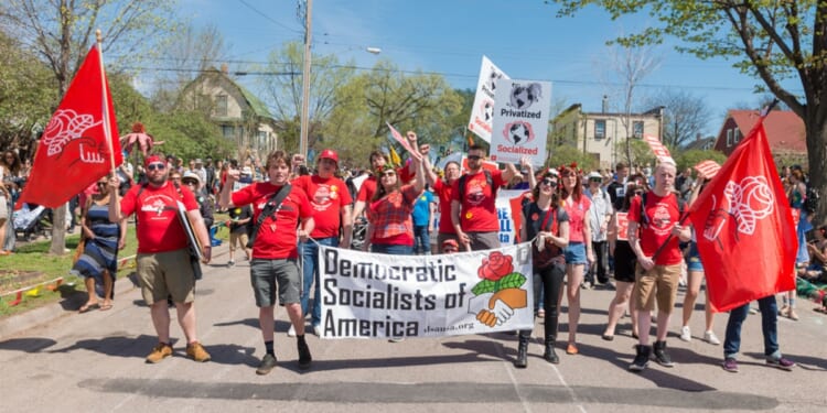 The Democratic Socialists of America march during the annual May Day parade in Minneapolis on May 6, 2018. The party is in dire financial straits after its public support for the Hamas terrorist group.