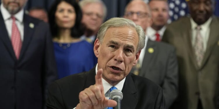 Defiant Texas Gov. Greg Abbott cites migrant 'invasion' in escalation with Joe Biden over border