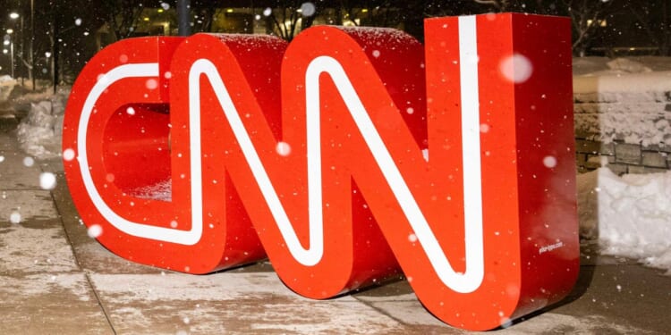 Snow falls on the CNN logo outside the fifth Republican presidential primary debate in Des Moines, Iowa, on Jan. 10.