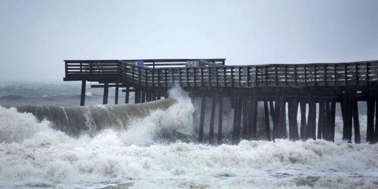 At least one presumed dead after car drives off Virginia Beach Fishing Pier into the ocean