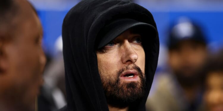 Eminem stands on the field prior to an NFL wild-card playoff football game between the Detroit Lions and the Los Angeles Rams in Detroit, Michigan, on Jan. 14.