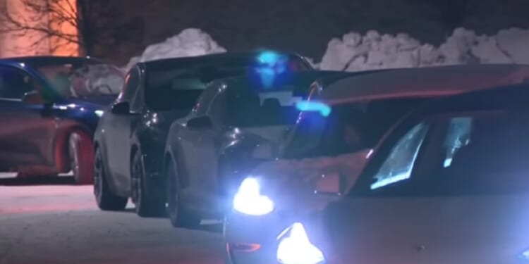 A line of electrict vehicles crowds a charging station outside of Chicago. Biting cold temperatures not only sap electric vehicle battery power, the increase charging times.