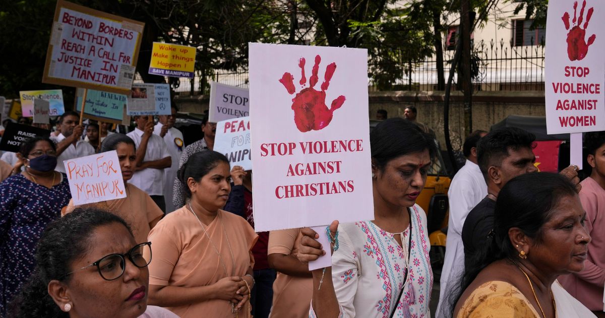 Catholic Christians hold placards and participate in a peace rally against violence in the northeastern Manipur state, in Hyderabad, India, Aug. 25.