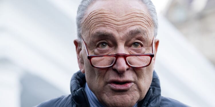 Senate Majority Leader Chuck Schumer speaks to reporters following a meeting with President Joe Biden about government funding outside the White House in Washington, D.C., on Jan. 17.