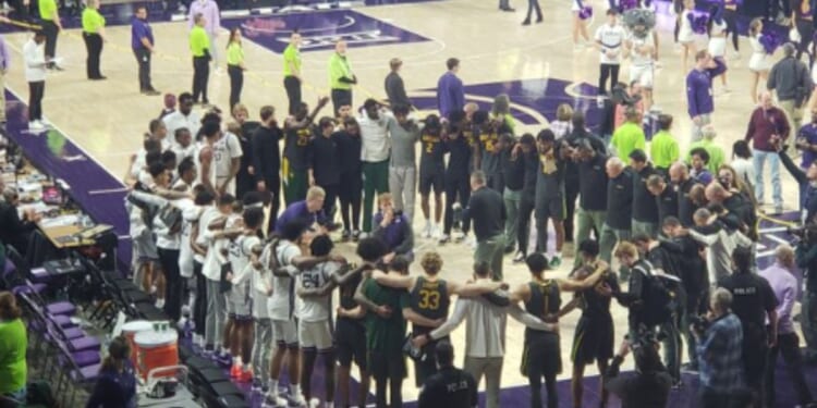 On Tuesday, the Kansas State Wildcats men’s basketball team upset the ninth-ranked Baylor Bears in overtime, 68-64. Then, players and staff members from both teams came together in a circle to pray.