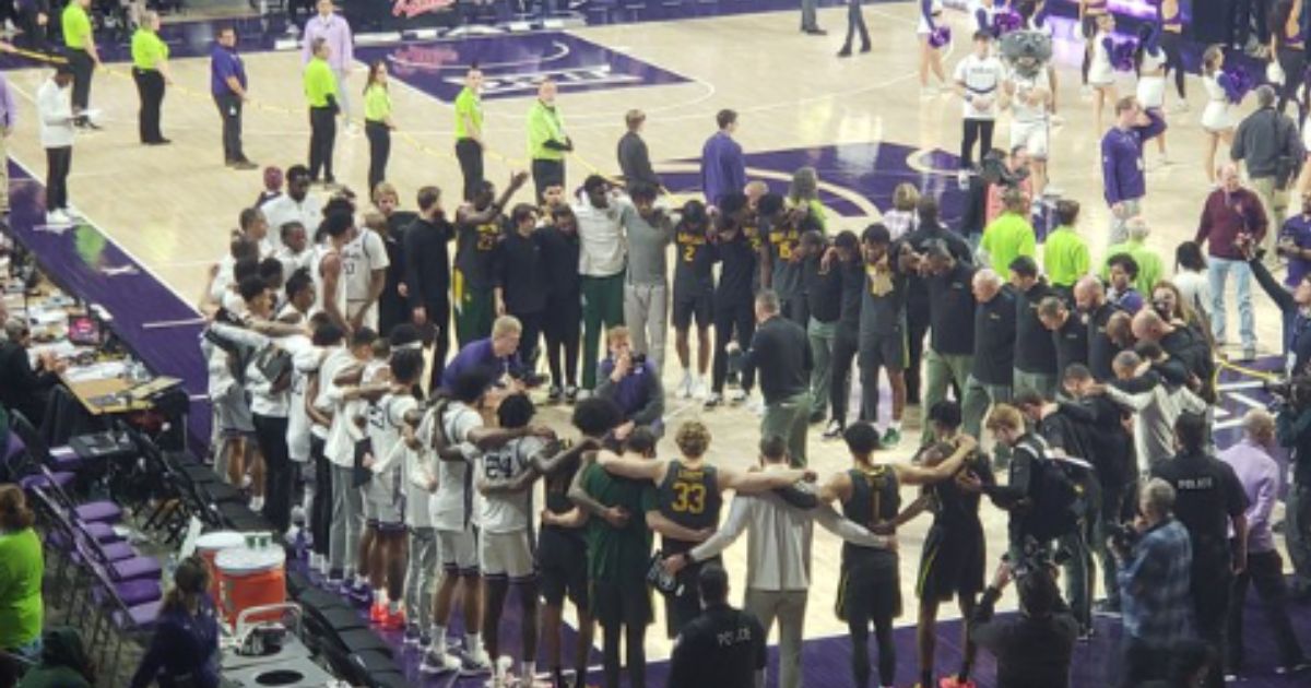 On Tuesday, the Kansas State Wildcats men’s basketball team upset the ninth-ranked Baylor Bears in overtime, 68-64. Then, players and staff members from both teams came together in a circle to pray.