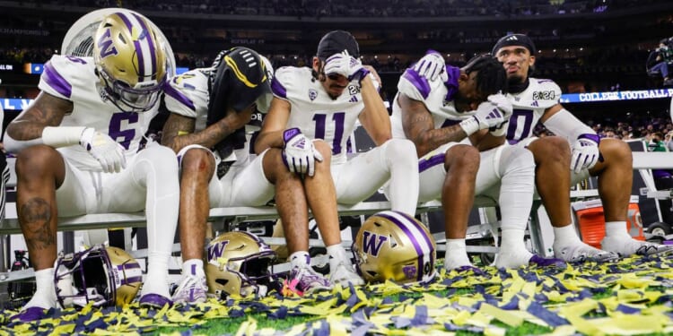 Washington Huskies players react to losing the 2024 CFP National Championship game.