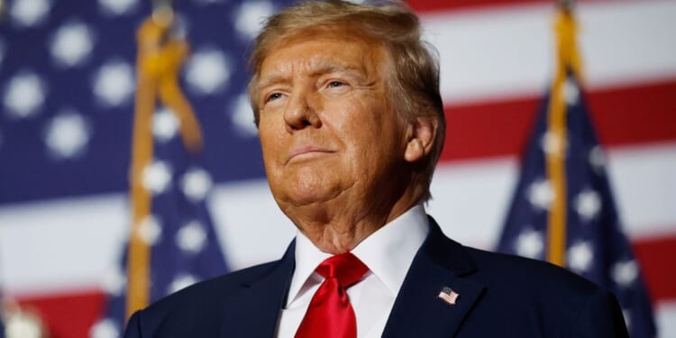 Former President Donald Trump speaks at his caucus night event in Des Moines, Iowa, on Monday.