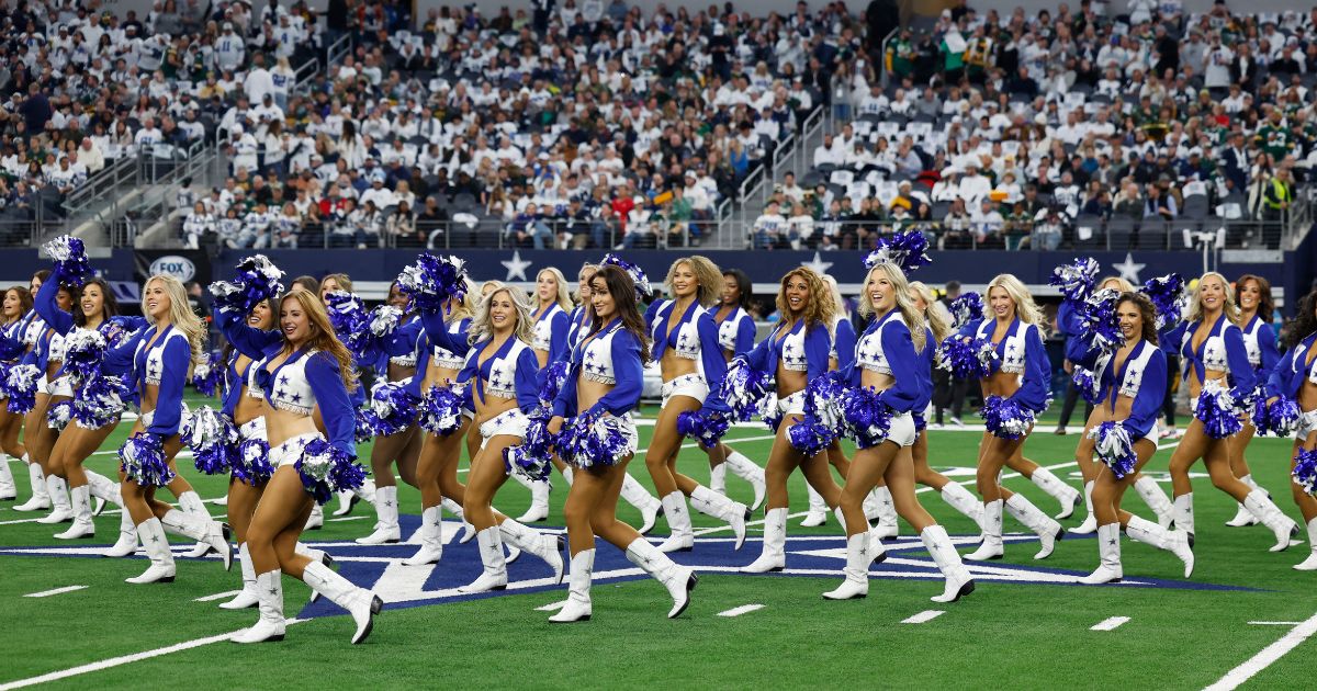 The Dallas Cowboys cheerleaders perform before the team's wild-card playoff game against the Green Bay Packers in Arlington, Texas, on Sunday.