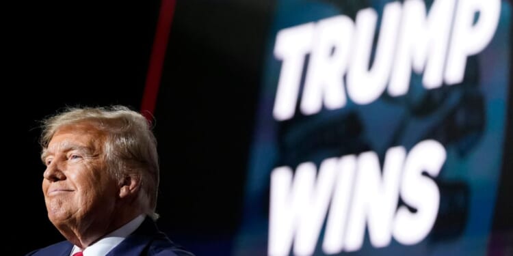 Former President Donald Trump speaks at a caucus night party in Des Moines, Iowa, on Jan. 15.