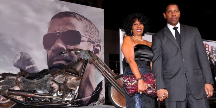 Pauletta Washington and actor Denzel Washington arrive at the premiere of Warner Bros. 'The Book Of Eli' held at Grauman's Chinese Theatre on January 11, 2010 in Hollywood, California.