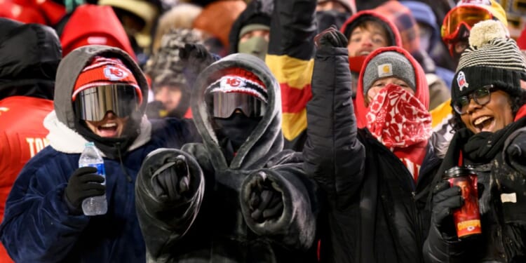 Kansas City Chiefs fans celebrated despite the below-zero temperatures during the second half of an NFL wild-card playoff football game against the Miami Dolphins, Saturday in Kansas City, Missouri.