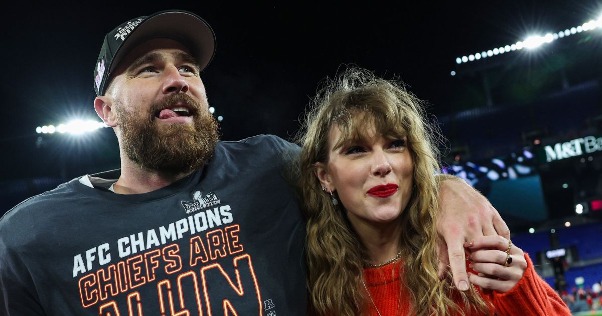 Travis Kelce, left, and Taylor Swift, right, celebrate after the Kansas City Chiefs defeat the Baltimore Ravens in Baltimore on Sunday to become the AFC Champions.