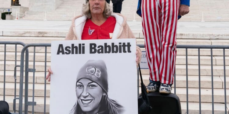 Micki Witthoeft, mother of Ashli Babbitt, the woman fatally shot by police inside the U.S. Capitol on Jan. 6, 2021, joins protesters outside of the Supreme Court in Washington, Jan. 6, 2023.