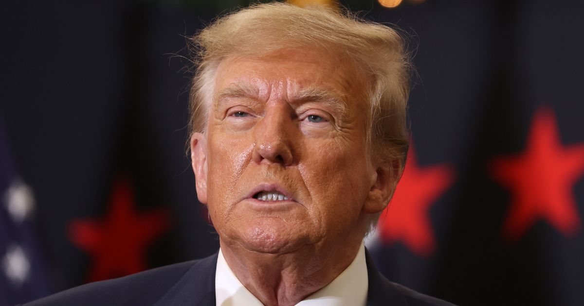 Republican presidential candidate and former President Donald Trump looks on during a campaign event in Waterloo, Iowa, on Dec. 19.