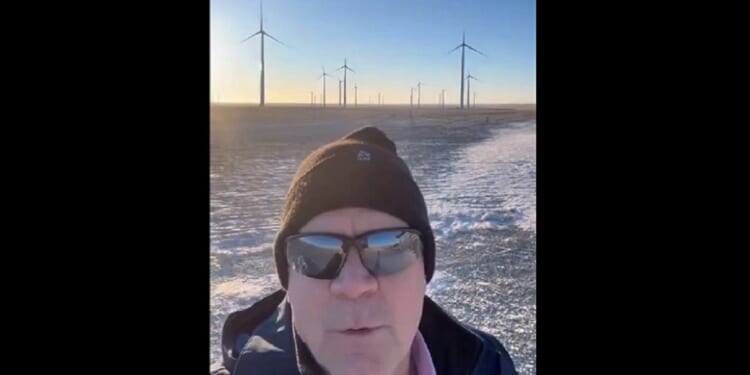 Republican Rep. Matt Rosendale in a still from a video of a visit to a wind turbine facility where none of the turbines are spinning.