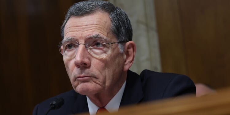 Republican Sen. John Barrasso of Wyoming looks on during a hearing in Washington on May 2.