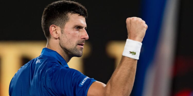 Novak Djokovic of Serbia celebrates match point against Tomas Martin Etcheverry of Argentina during the Australian Open at Melbourne Park in Melbourne on Friday.