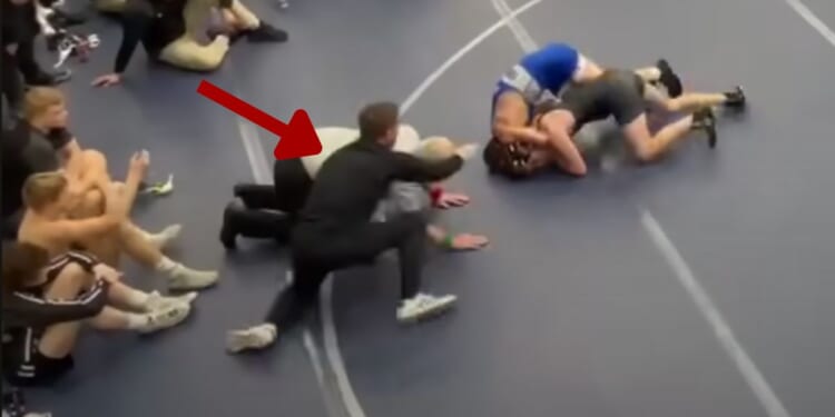 Assistant wrestling coach Russell Brunson of Rocky Mountain High School in Meridian, Idaho, has been banned for coaching for life after he moved onto the mat during his son's match on Jan. 20 and struck the teenage opponent.