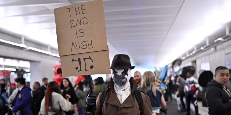 A cosplayer poses as Rorschach from Watchmen during New York Comic Con 2023 - Day 3 at Javits Center on October 14, 2023 in New York City.