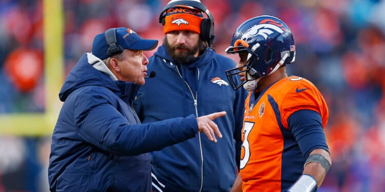 Denver Broncos coach Sean Peyton, left, talks with quarterback Russell Wilson during an October game with the Kansas City Chiefs in Denver.