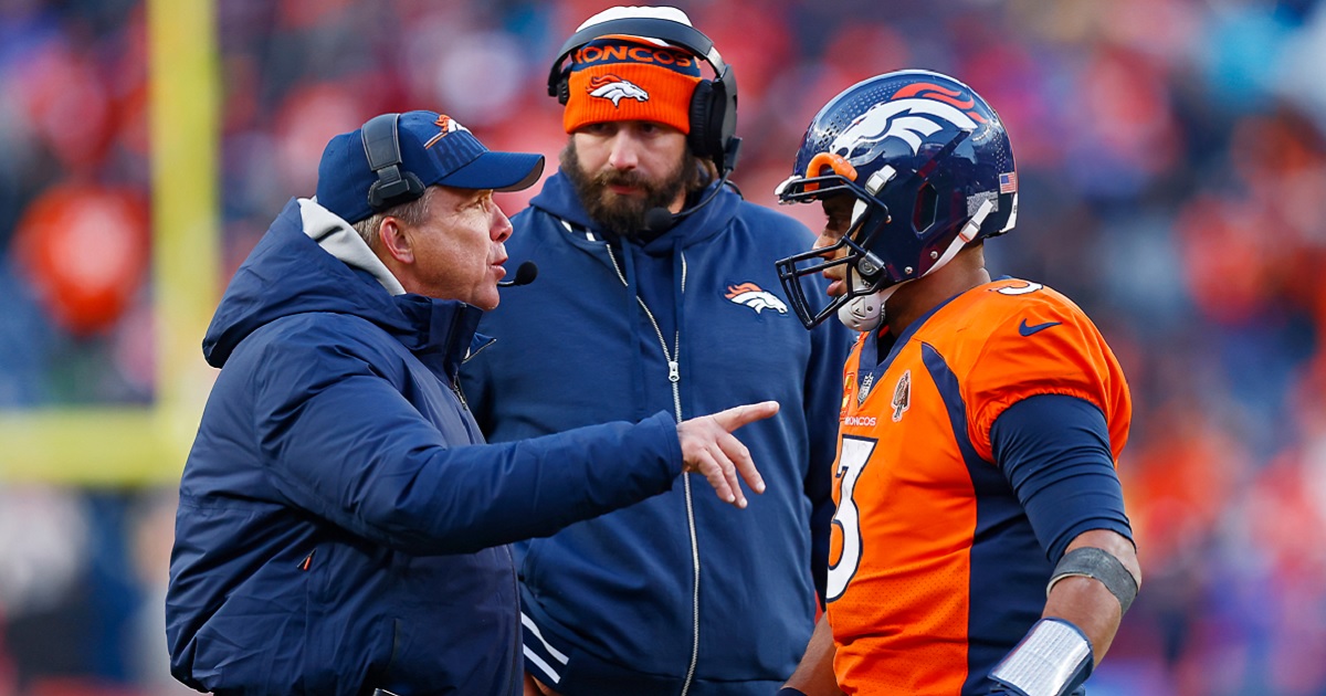 Denver Broncos coach Sean Peyton, left, talks with quarterback Russell Wilson during an October game with the Kansas City Chiefs in Denver.