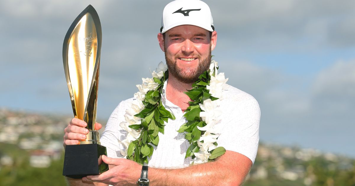 Grayson Murray of the United States poses with the trophy after winning the Sony Open in Honolulu, Hawaii, on Sunday.