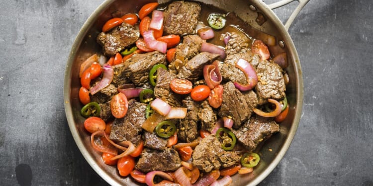 Lomo Saltado: Peruvian beef stir-fry with onions and tomatoes is fusion cooking at its best