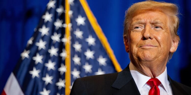 Republican presidential candidate and former President Donald Trump looks on during a campaign rally at the Atkinson Country Club in Atkinson, New Hampshire, on Tuesday.