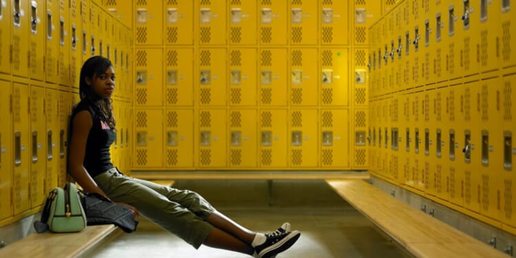 This stock image pictures a teenage girl in a female locker room of a high school. A West Virginia mother recently argued against a school board for allowing males who claim to be transgender access to the female locker rooms.