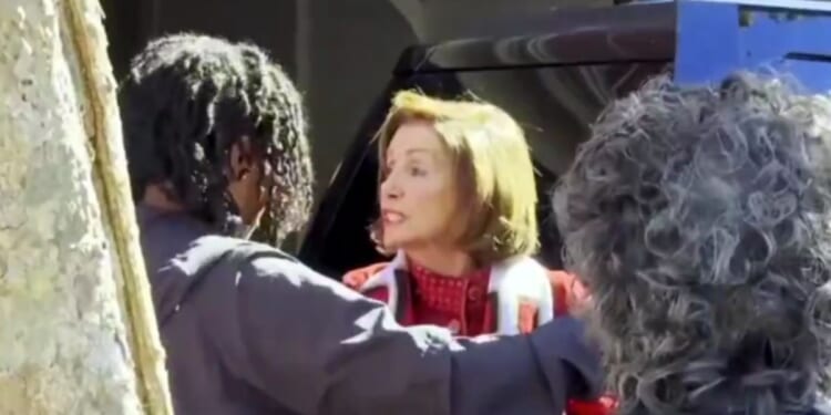 Former Speaker of the House Nancy Pelosi confronted protesters outside her home in San Francisco on Monday, telling them to "go back to China."