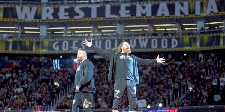 Wrestlers Kevin Owens and Sami Zayn performing at WrestleMania 39.