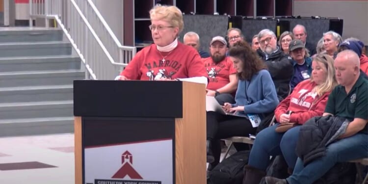 People speak at a Southern York County School District board meeting in York, Pennsylvania, on Thursday.