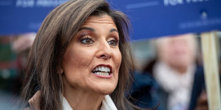 Republican presidential hopeful Nikki Haley speaks to the media during the primary outside a polling site at Winnacunnet High School in Hampton, New Hampshire, on Tuesday.