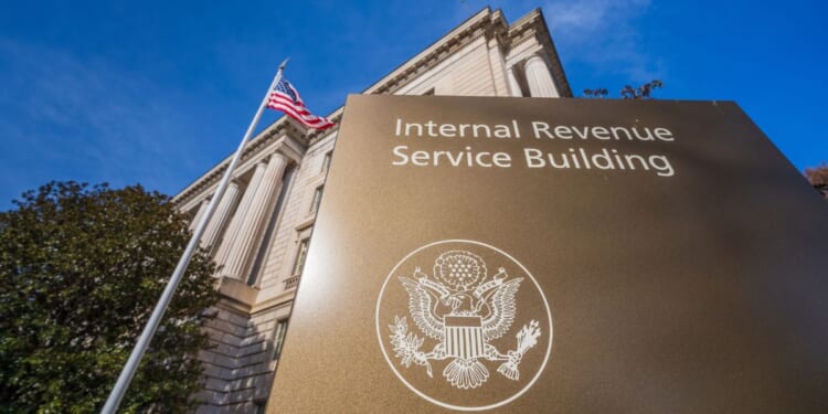 The U.S. flag flies over the IRS headquarters in Washington on Jan. 3.