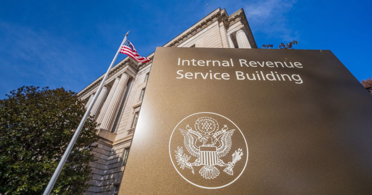 The U.S. flag flies over the IRS headquarters in Washington on Jan. 3.