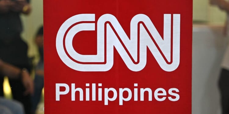 The logo of CNN Philippines is seen outside their office in Mandaluyong, Metro Manila on Monday. The CNN Philippines officially announced that it will stop news production operations effective on January 31, as a result of "serious financial losses."