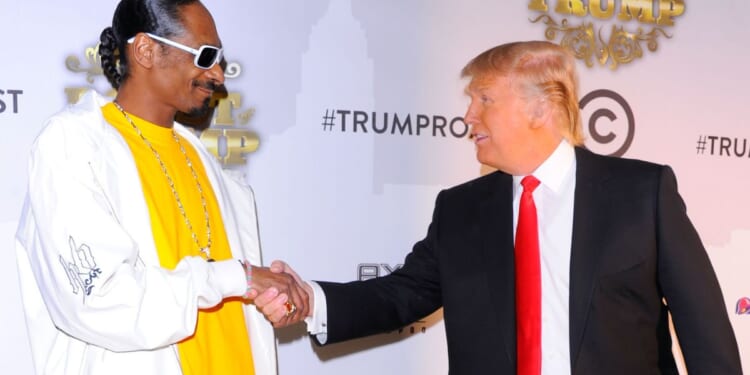 Snoop Dogg and Donald Trump shake hands at the Comedy Central Roast of Donald Trump at the Hammerstein Ballroom in New York City on March 9, 2011.