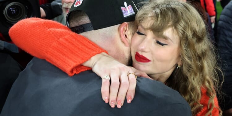 Pop star Taylor Swift hugs boyfriend Travis Kelce, a tight end for the NFL's Kansas City Chiefs, after the Chiefs 17-10 victory against the Baltimore Ravens in the AFC Championship Game in Baltimore on Sunday.