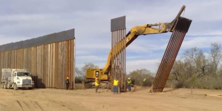 Texas Gov. Greg Abbott posted a video on Tuesday showing off the border wall he was erecting to defend the Texas-Mexico border.