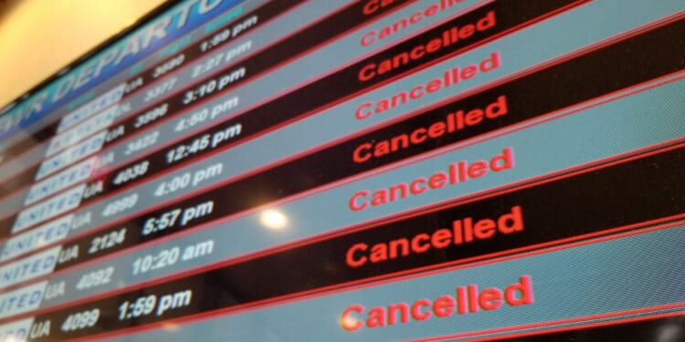 A flight departures board shows all flights canceled during a 2018 snow event at Newark International Airport in Newark, New Jersey.