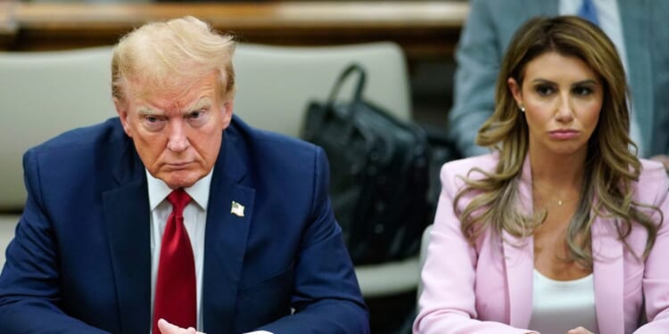 Former President Donald Trump, left, and his attorney Alina Habba, right, sit at the defense table in the New York State Supreme Court in New York City on Dec. 7.